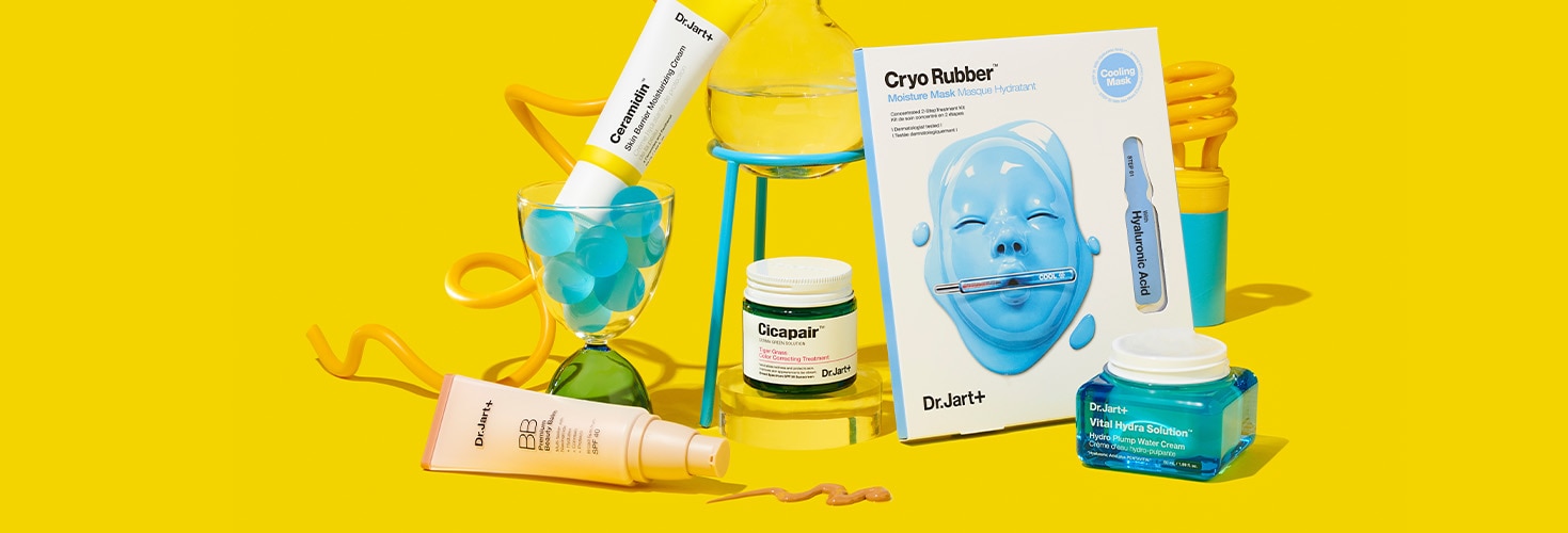 Dr.Jart+'s bestselling skincare products balanced on brightly colored science lab components with a cheery yellow backdrop. 