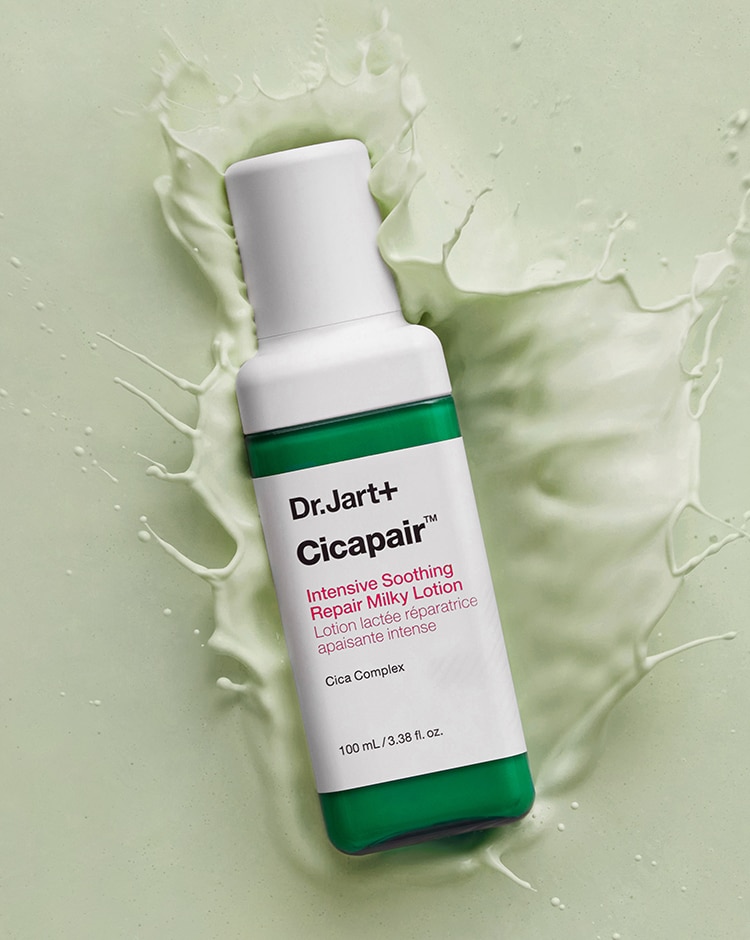 Bottle of Cicapair Milky Face Moisturizer Lotion splashes into the lightweight, fluid formula