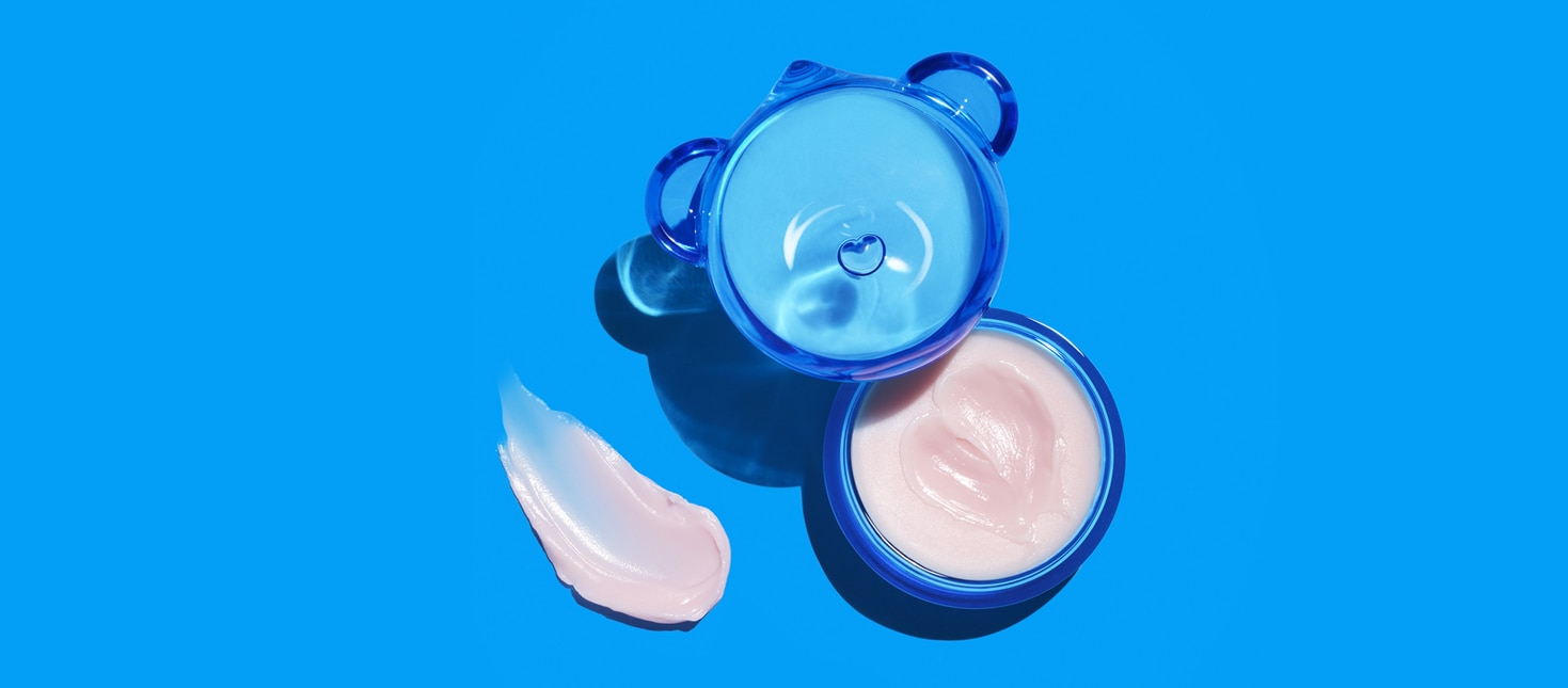 Dr.Jart+'s jelly bear lip mask open jar with shiny pink gel formula and texture swipe.