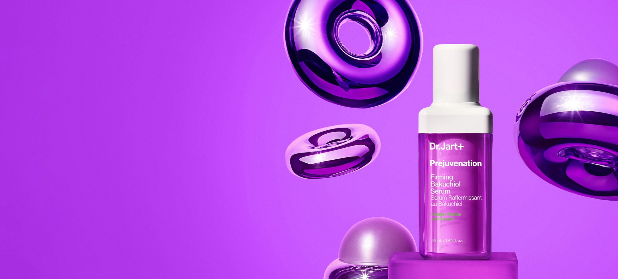 A bottle of Prejuvenation Serum is displayed in front of a bright purple backgrop with mylar-like floating molecular elements.