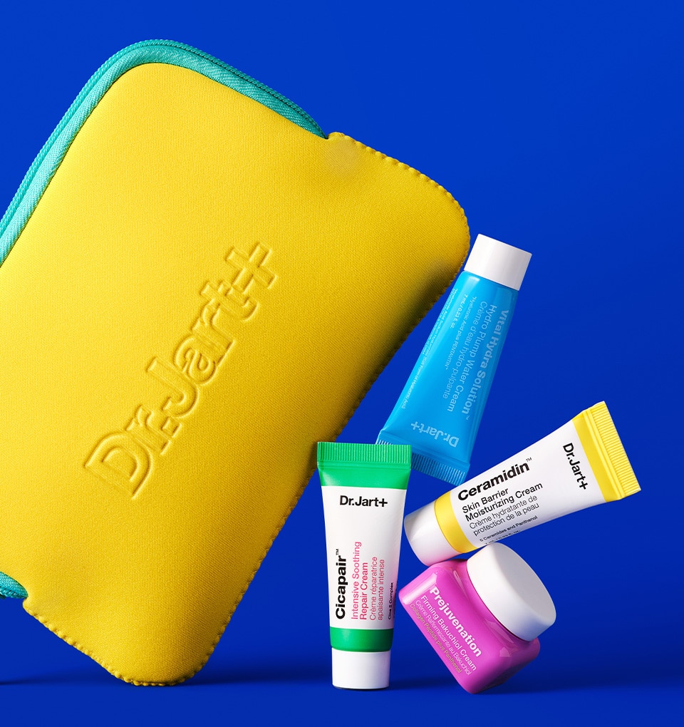 A bright yellow Dr.Jart+ pouch balances on mini moisturizer samples.